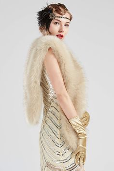 a woman in a gold dress and fur stole