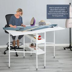 a woman is sitting at a desk with an ironing board