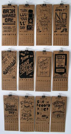 several calendars are hanging on a wall with some type of paper attached to them