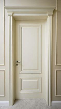 an open door in a room with white walls and trimmings on the doors