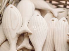 some white wooden spoons and forks in a basket