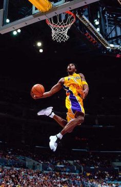 a basketball player jumping up into the air