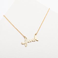 Wear a fuck necklace and give absolutely zero fucks at the same time. DETAILS- 14k gold-plated sterling silver or sterling silver- Closes with a lobster style clasp- Pendant is 1 inch in size and features Larissa's real handwriting- Nickel-free and naturally hypoallergenic- Adjustable length - can be worn at 17, 18 or 19 inches Blondie Heart Of Glass, Blondie Band, Oversized Band Tee, Script Necklace, Rock Gifts, Necklace Stack, Night Out With Friends, Brass Pendant, Out With Friends