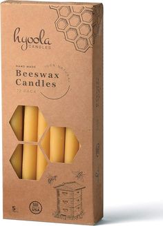 four beeswax candles in a cardboard box