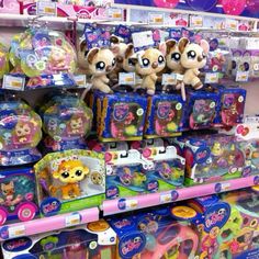 several littlest pet toys are on display in the store for kids to play with