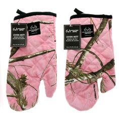 the oven mitts are pink and green with mossy trees on them, one has an open mitt