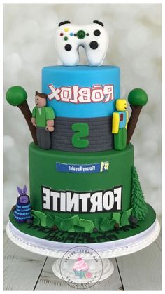 a cake that is sitting on top of a table with video game characters on it