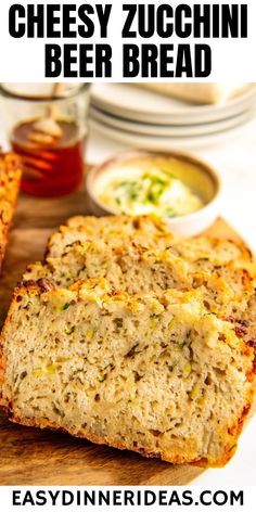 two slices of cheesy zucchini beer bread on a cutting board