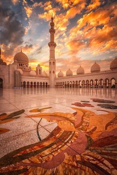 the grand mosque in abura is illuminated by the sun's rays as it shines through the clouds