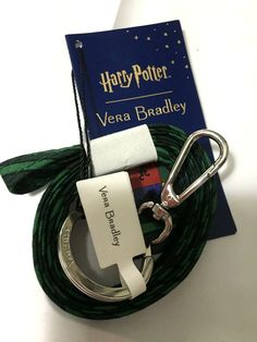 a harry potter keychain with a book and lanyard