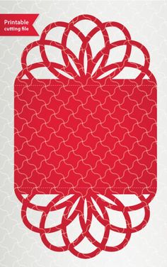 a red paper cutout with an ornate design in the shape of a flower on a white background