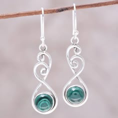 In these dangle earrings designed by Shanker of India, a round cabochon of malachite swings in an arc of sterling silver wire. Graceful swirls of the sterling silver wire at the top of the earrings create lovely and elegant shapes. Soldered Earrings, Silver Wire Earrings, Wire Wrapped Stone Jewelry, Malachite Jewelry, Wire Jewelry Designs, Swirl Earrings, Green Malachite, Diy Wire Jewelry, Wire Wrap Jewelry