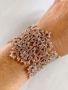 a woman's arm with a bracelet on it