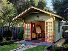 a garden shed with an open front door