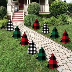 plaid christmas trees in front of a house