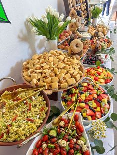 a buffet table filled with lots of different foods