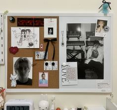 a cork board with pictures and magnets on it