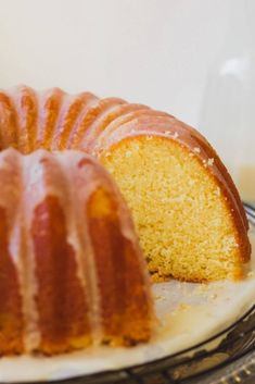 a bundt cake on a plate with one slice cut out