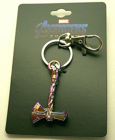 the avengers keychain has an iron - man symbol on it