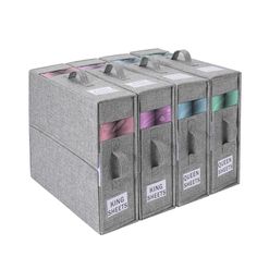 three gray boxes with different colored ribbons in them