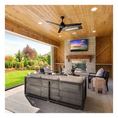 a living room filled with furniture and a flat screen tv mounted to the side of a wall