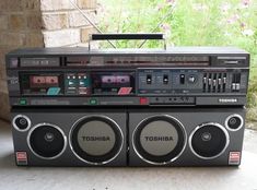 an old radio sitting on top of a table