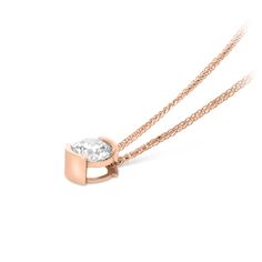 Modern and sophisticated, this necklace is a captivating look any woman would adore. Beautifully crafted, this ring features a dazzling 1 Carat center stone placed prominently in an 18K rose gold half-bezel setting that enhances the diamond's size and sparkle.  This classic look is one she'll turn to often, everyday, and on special occasions. An amazing and thoughtful anniversary gift for your loved one.
1.01 round brilliant cut H VS2
18k rose gold

The Pendant design can be Half Bezel Setting, Half Bezel, Gold Link Chain, Pave Pendant, Gold Link, Bezel Set Diamond, Orange Sapphire, Diamond Star, To Be Loved