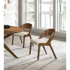 Add a modern touch to your living space with this woodson dining chair. Featuring a wooden frame with rich walnut veneer on solid wood legs, this chair is designed to last. Soft light linen-like polyester fabric upholsters its foam seat, providing a comfortable place for you to sit. Its midcentury modern design is the perfect fit for any contemporary living space, providing your home with a warm touch that stands out. Upholstery Color: Beige | Wade Logan® Caihden Side Chair 30.2 H x 19.88 W x 23 Ercol Furniture, Wood Side Chair, Midcentury Modern Dining Chairs, Gray Dining Chairs, Comfortable Place, Grey Dining, Mid Century Modern Dining, Meridian Furniture, Contemporary Living Spaces