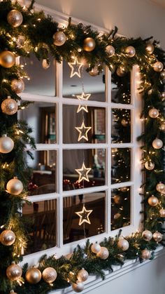 The combination of lights, decorations, and the wooden furniture creates an inviting atmosphere filled with warmth and holiday cheer. Christmas Window Frame Decorations, Scandinavian Dining Room, Fall Bedroom Decor, French Interior Design, Wooden Table And Chairs, Scandinavian Dining, Living Room Setup