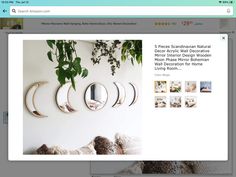 a screen shot of a website page with an image of three circular mirrors on the wall