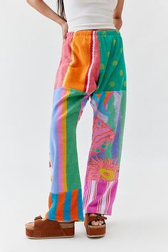 Remade Pieced Towel Pants from Urban Renewal cut in a mid-rise with a straight leg. Features an allover vibrant design made from beach towels. This modern design was created by Urban Renewal from unique vintage and deadstock items found around the world. Though similar in style to what you see here, each upcycled item is one-of-a-kind and may vary from piece to piece. Features Remade Pieced Towel Pants from Urban Renewal Made from pieced beach towels for a vibrant look Elasticated waistband Urban Renewal Remade features upcycled pieces reimagined by our Urban Renewal team Updated by hand in the US, so no two are exactly alike You will receive a completely unique piece that will vary from the item pictured here Content + Care Vintage fabrics vary Machine wash Made in the USA Size + Fit Mode Ocean Pacific Clothing, Towel Clothing, Towel Pants, Spa Outfit, Towel Clothes, Funky Pants, Urban Outfitters Clothes, Fun Clothes, Vintage Clothes Women