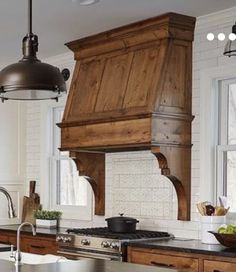 a kitchen with wooden cabinets and an island