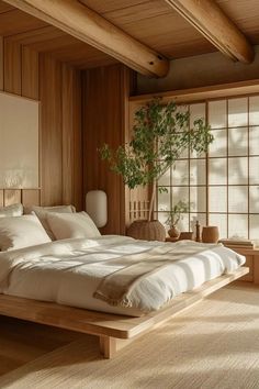 a large bed sitting inside of a bedroom next to a wooden wall with windows on each side