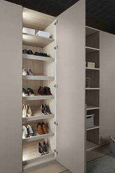 an empty closet with several pairs of shoes in it