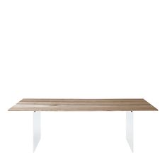 a wooden table sitting on top of a white floor