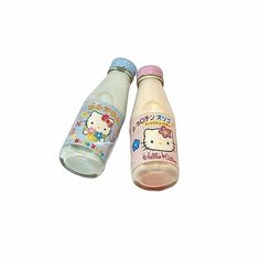 two plastic bottles with hello kitty designs on them