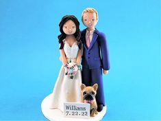 a figurine of a bride and groom with a dog on their wedding day