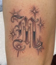 a tattoo with the letter m on it