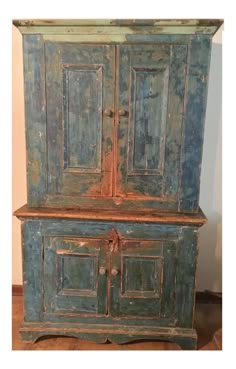 an old wooden cabinet with two doors