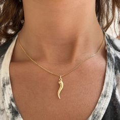 The sleek lines of this hand crafted 14K Gold Italian Horn Charm create a unique piece that can be worn every day. A traditional Italian symbol of good luck and protection, the horn charm is a timeless piece whose good vibes you'll feel as your neckline shines. Layer it with your favorite Babygold charms or alone for a Italian Symbols, Italian Horn Necklace, Italian Horn, Horn Necklace, The Horn, Seat Belt, Timeless Pieces, Good Vibes, Good Luck