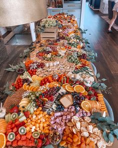 a large platter filled with lots of different types of fruit and veggies