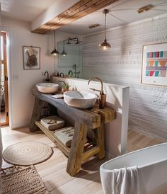 a bathroom with two sinks and a bathtub