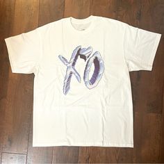 Authentic Xo The Weeknd T-Shirt. Size Xl Nwot, Unworn, Brand New White Base With Chrome Xo Logo. Lightly Wrinkled From How It Was Folded, But Brand New And Unworn. Unisex. Color May Vary Based On Lighting. Measurements Are Approx And Not Exact. Please Review All Images And Ask Questions Prior To Purchase. Comp/Stock Photos For Style And Price Reference Only, Not Included With Purchase. Peice Firm, Offers Not Accepted Xo Shirts The Weeknd, The Weeknd Tshirt, Xo Logo, The Weeknd T Shirt, Style Challenge, Swaggy Outfits, The Weeknd, Dream Style, Wish List