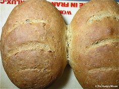 two loaves of bread sitting on top of a table