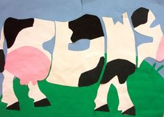 paper cut out of cows standing in the grass