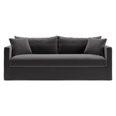 a black couch with two pillows on it's back and one arm facing the camera