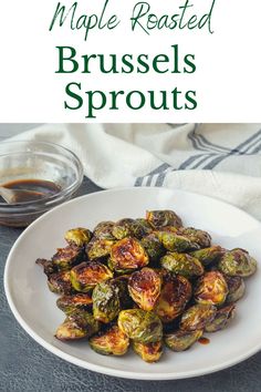 brussel sprouts on a white plate with the words maple roasted brussels sprouts