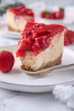 a slice of cheesecake with strawberry topping on a plate next to a strawberries