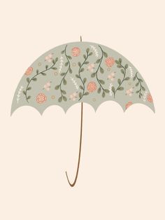 an umbrella with flowers and leaves on it is shown against a light blue sky background