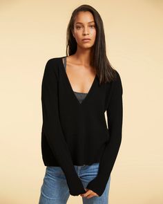 The Arianna V-neck top is made from 100% royal baby cashmere. Featuring loose, easy-fitting body with fitted, extra long ribbed sleeves. Optional thumbholes at sleeve ends. Sensual, deep plunging V neckline designed to be worn alone or layered with the Caterina cashmere bralette. Fully-fashioned knit sweater of the highest quality, created in micro-batches on hand-loom machines. Cashmere Pants, Cashmere Dress, Neckline Designs, Fully Fashioned, Royal Baby, Hand Loom, Layering Pieces, V Neck Tops, Cashmere Sweaters